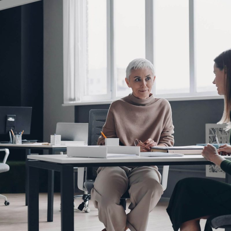 woman-having-interview-with-confident-hr-manager-while-sitting-at-the-office-desk-together.jpg